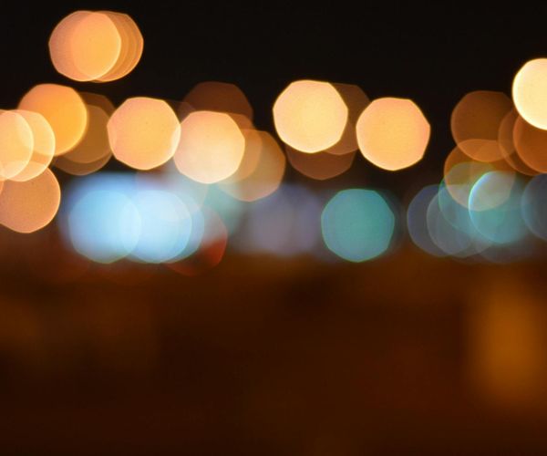 Abstract glowing light patterns in a dark space